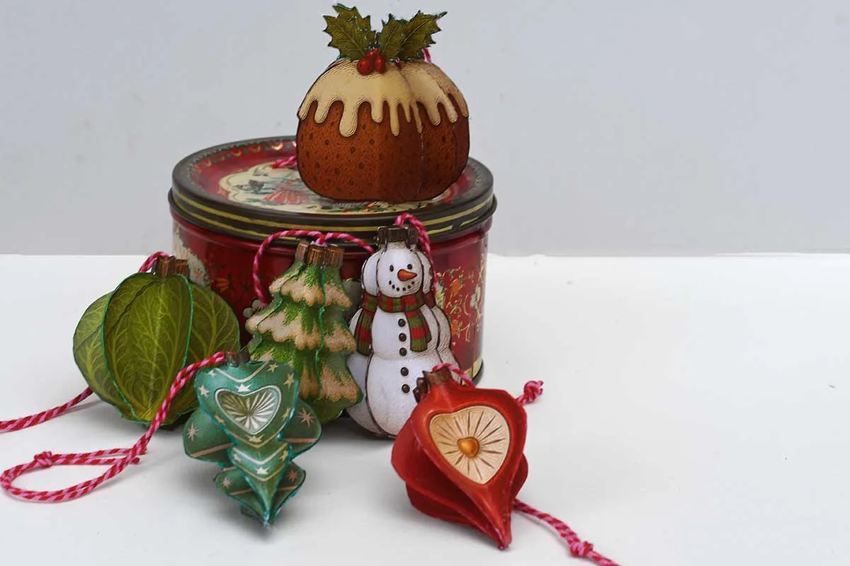 Six printable 3d retro paper Christmas ornaments Brussels sprout, Christmas pudding, snowman, Christmas tree and 2 shiny brite baubles with a vintage tin.
