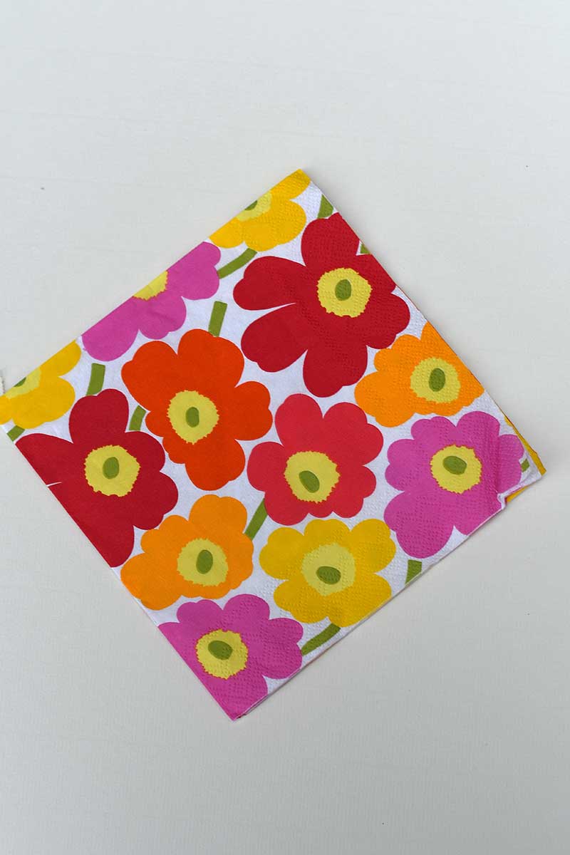 Marimekko paper napkin Unikko pattern in pink orange and red poppies