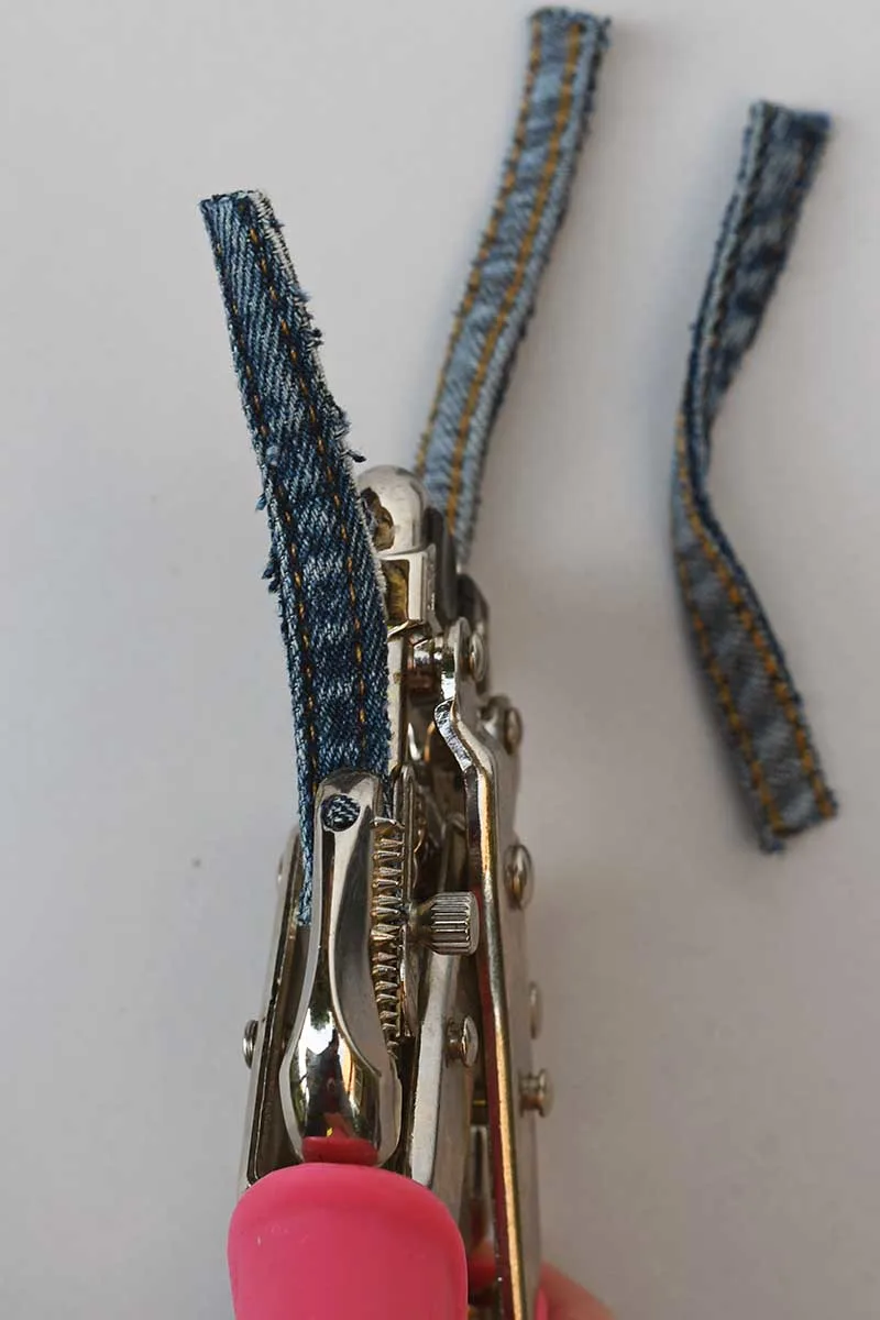 Punching holes into the denim seams  ends