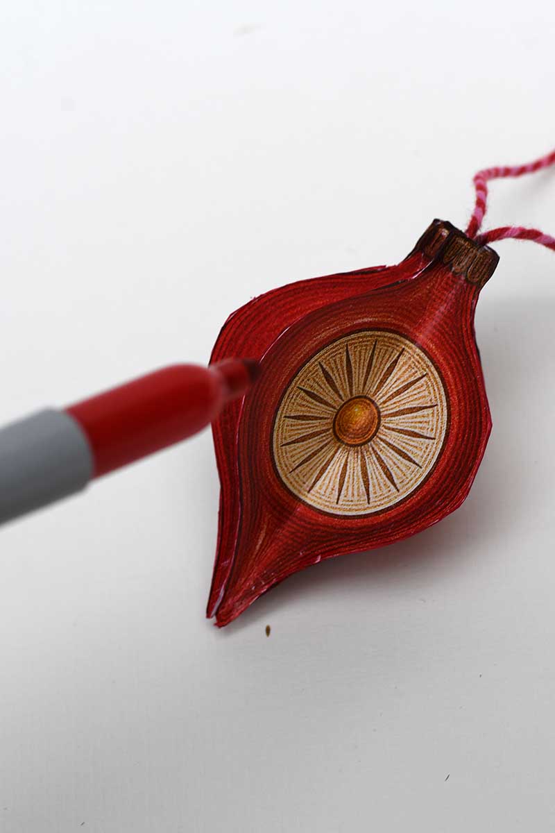 Sharpie the edges of the retro red paper ornament