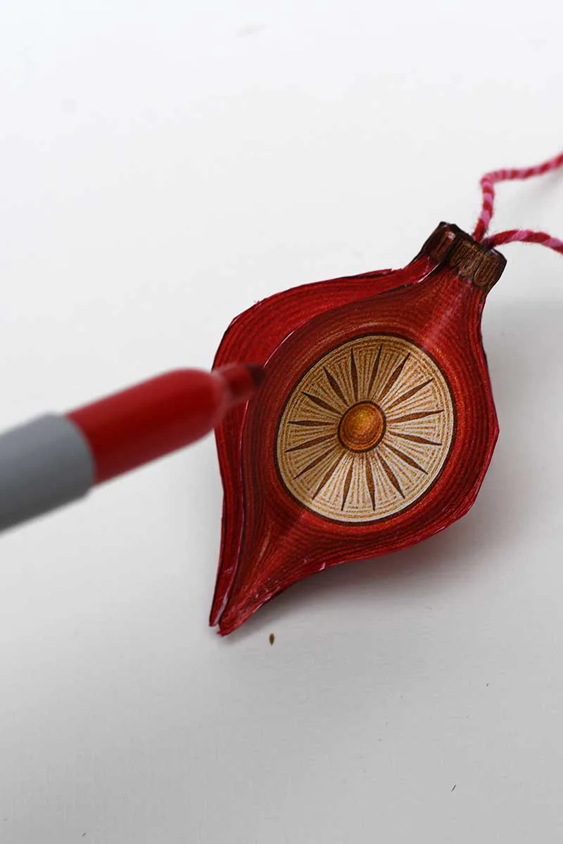 Sharpie the edges of the retro red paper ornament