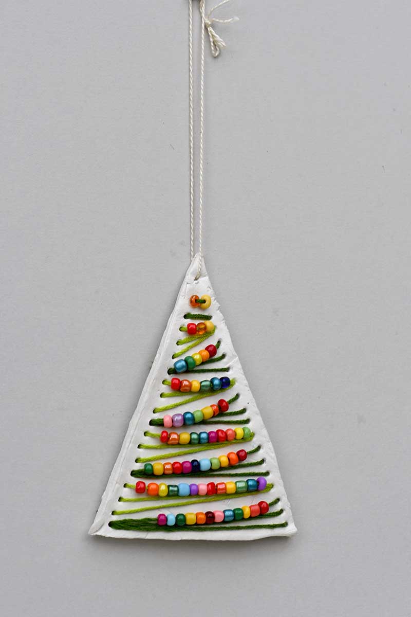 Beaded embroidered clay Christmas tree ornament.