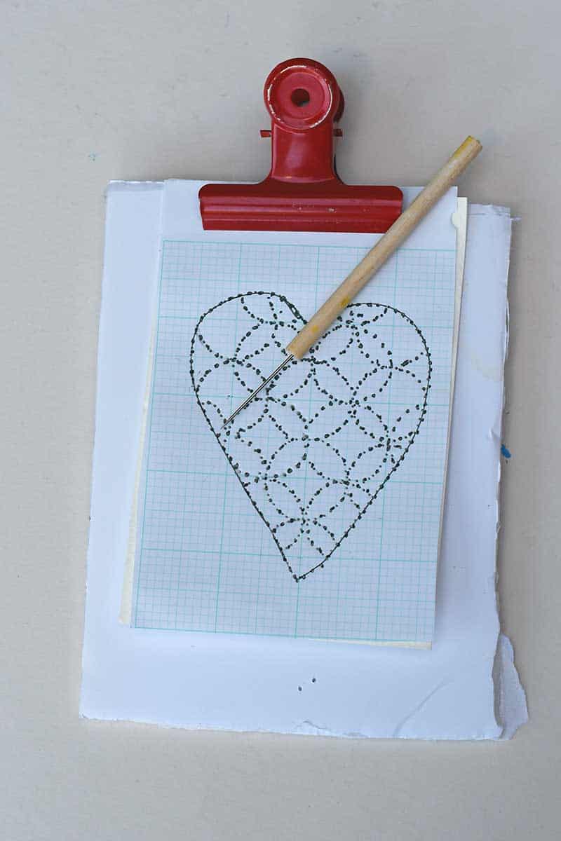 Punching holes in paper for Heart paper embroidery Sashiko style