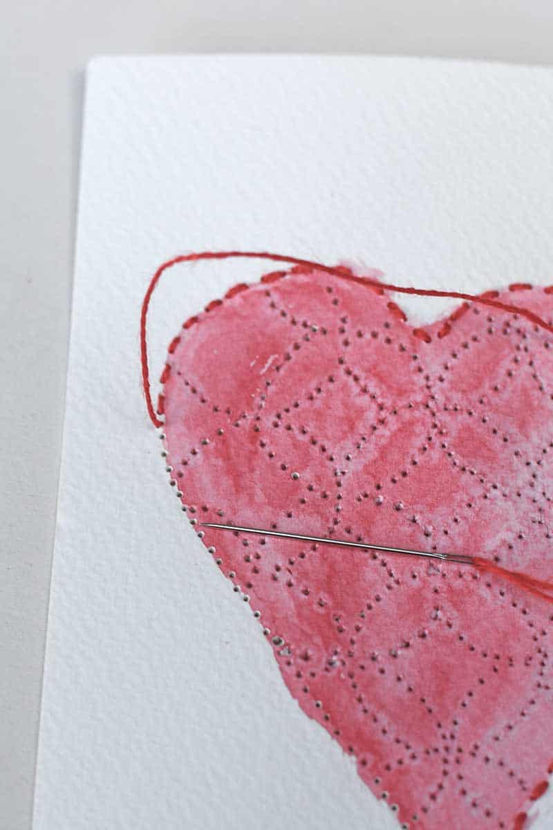 stiching around the Sashiko paper heart embroidery