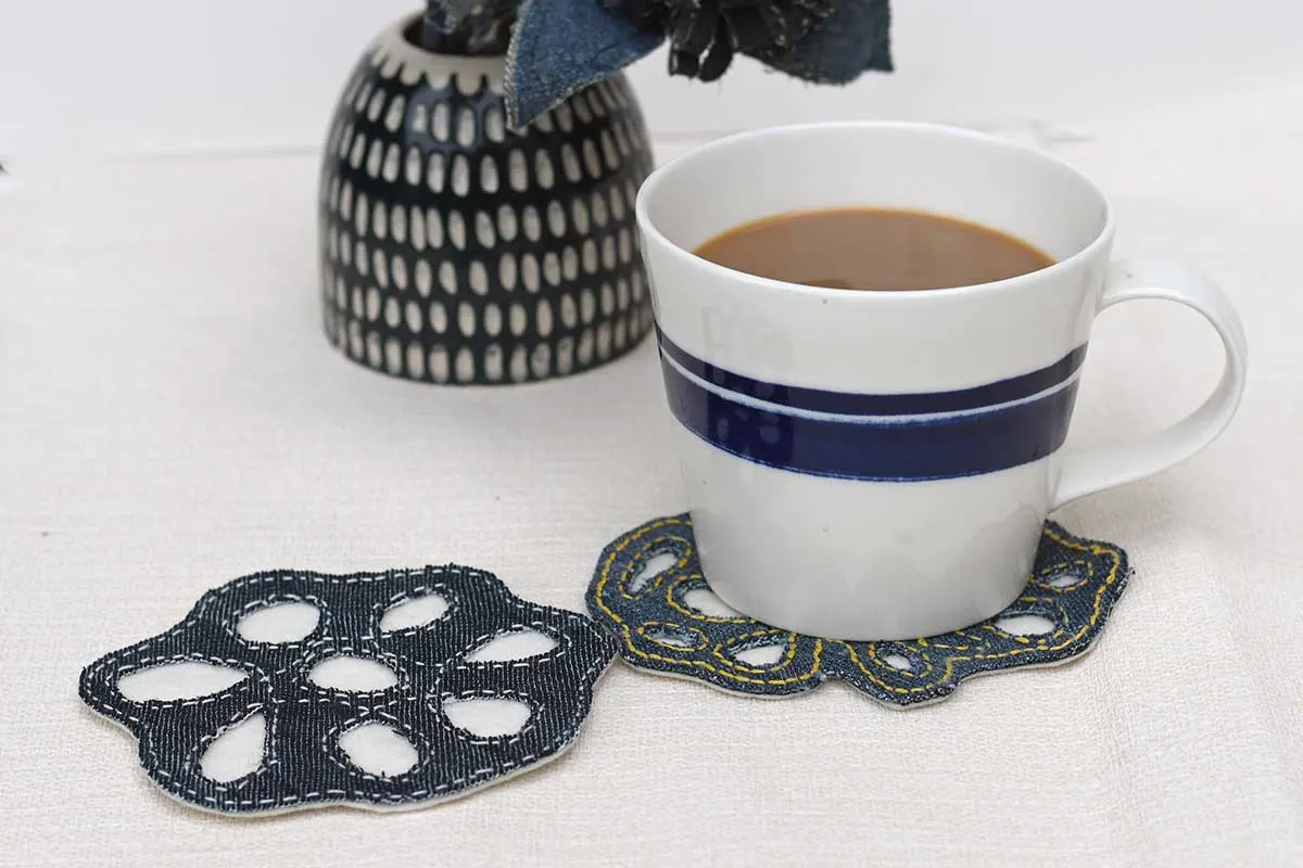 Two denim coasters hand stitched with cup of coffee feature