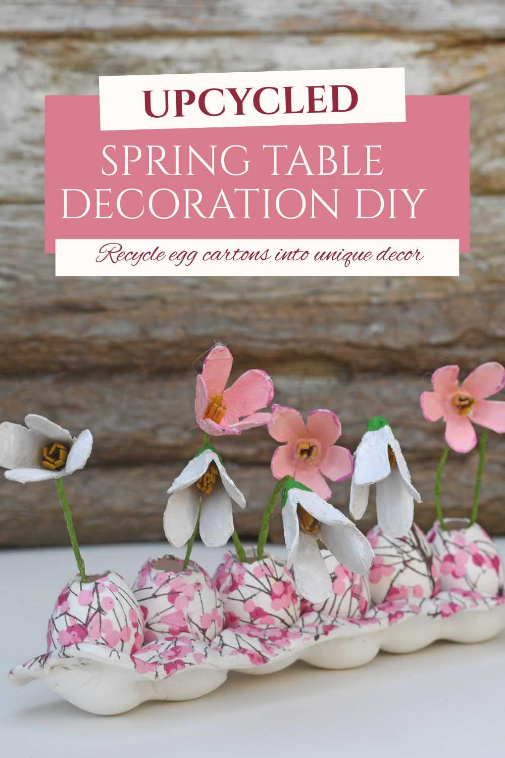 Create a unique DIY Easter or spring decoration using egg cartons, egg shells and air-dry clay. These cute egg box flowers sit in tiny decoupaged egg vases arranged in a handmade tray. A perfect recycled craft idea for spring decorating.