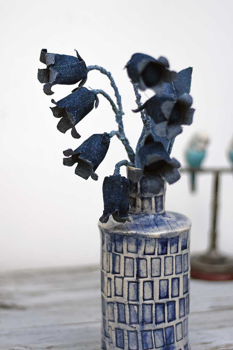 Denim bluebells in blue pttery vase