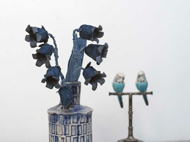 Denim blue bell flowers in blue vase