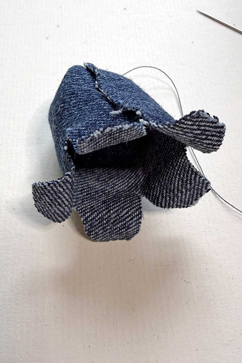 sewing the end of the denim bluebell flowers