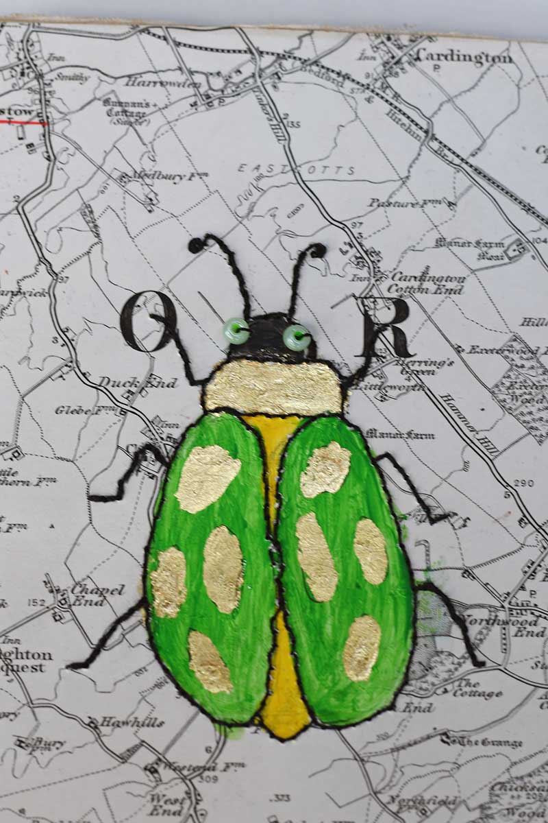 finished stitched green beetle