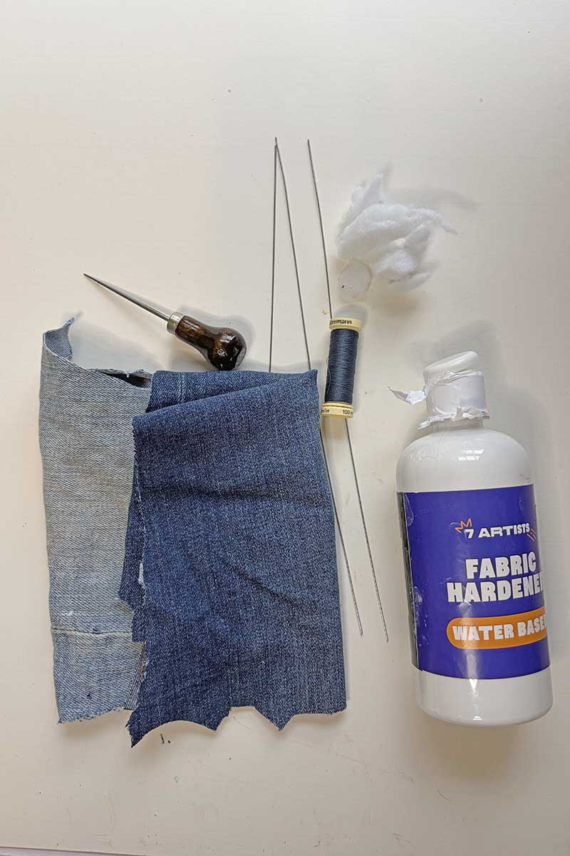 denim scraps, fabric stiffner, needle and thread and floristry wire to make denim bluebells.