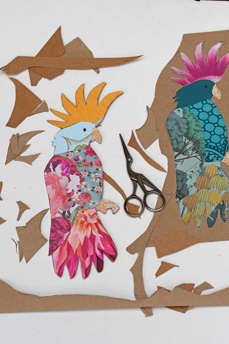 cutting out the collaged paper parrot decorations