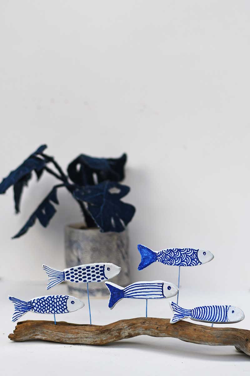 all the air dry clay fish displayed with plant