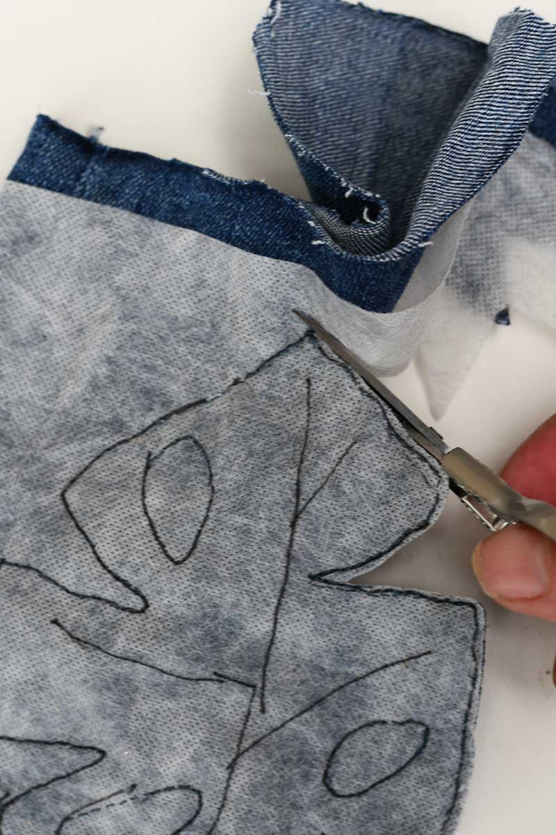 trimming around the edge of the stitched Monstera Leaf.
