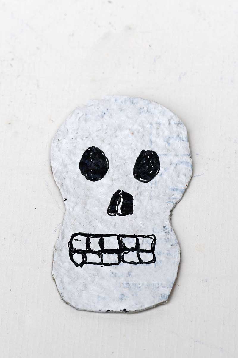 painted skull head with black sharpie face