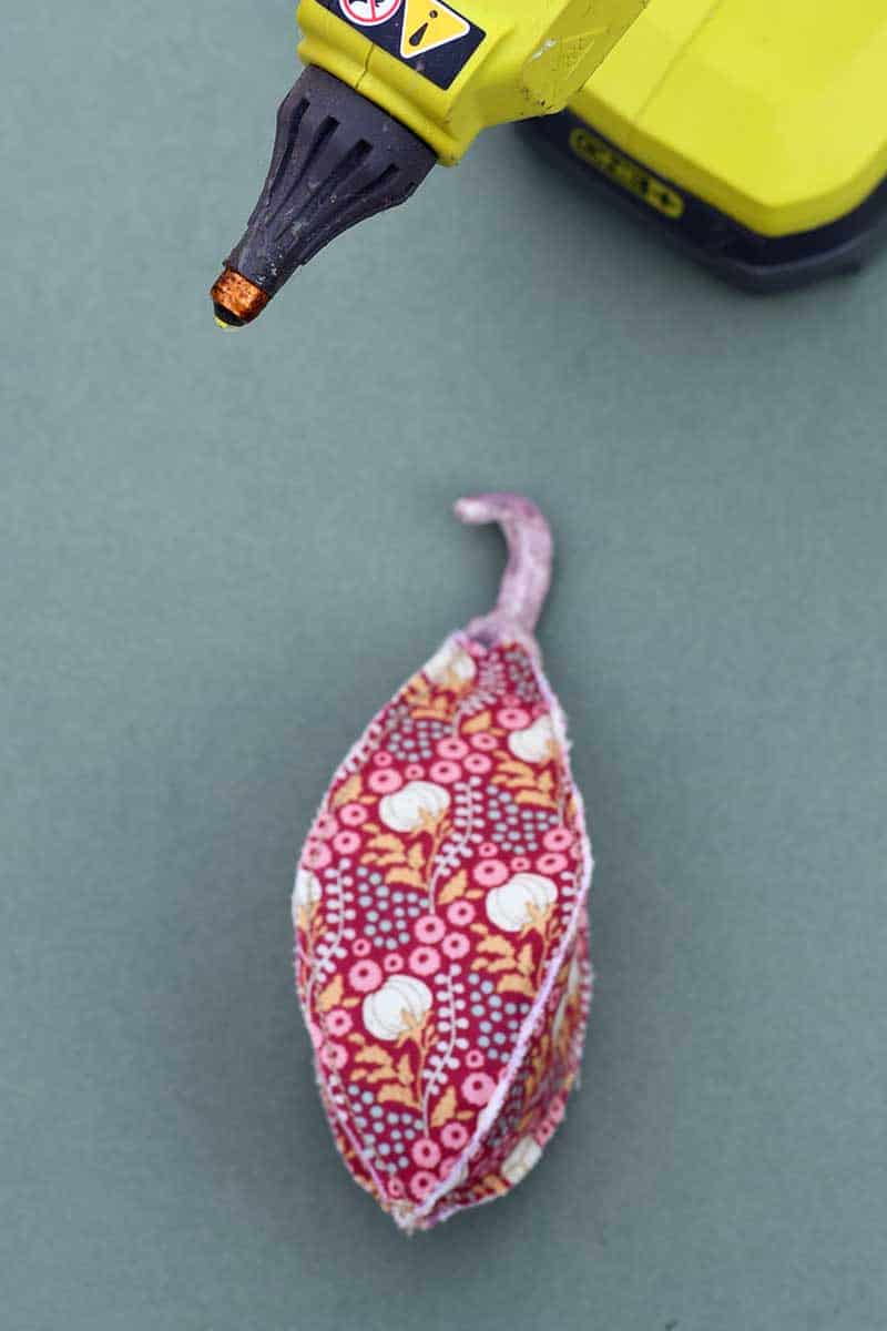 gluing in the stalk to fabric seed pod