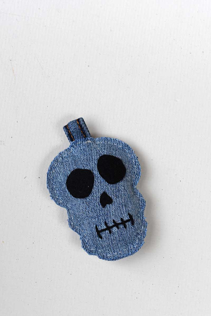 Finished denim skull halloween keychain