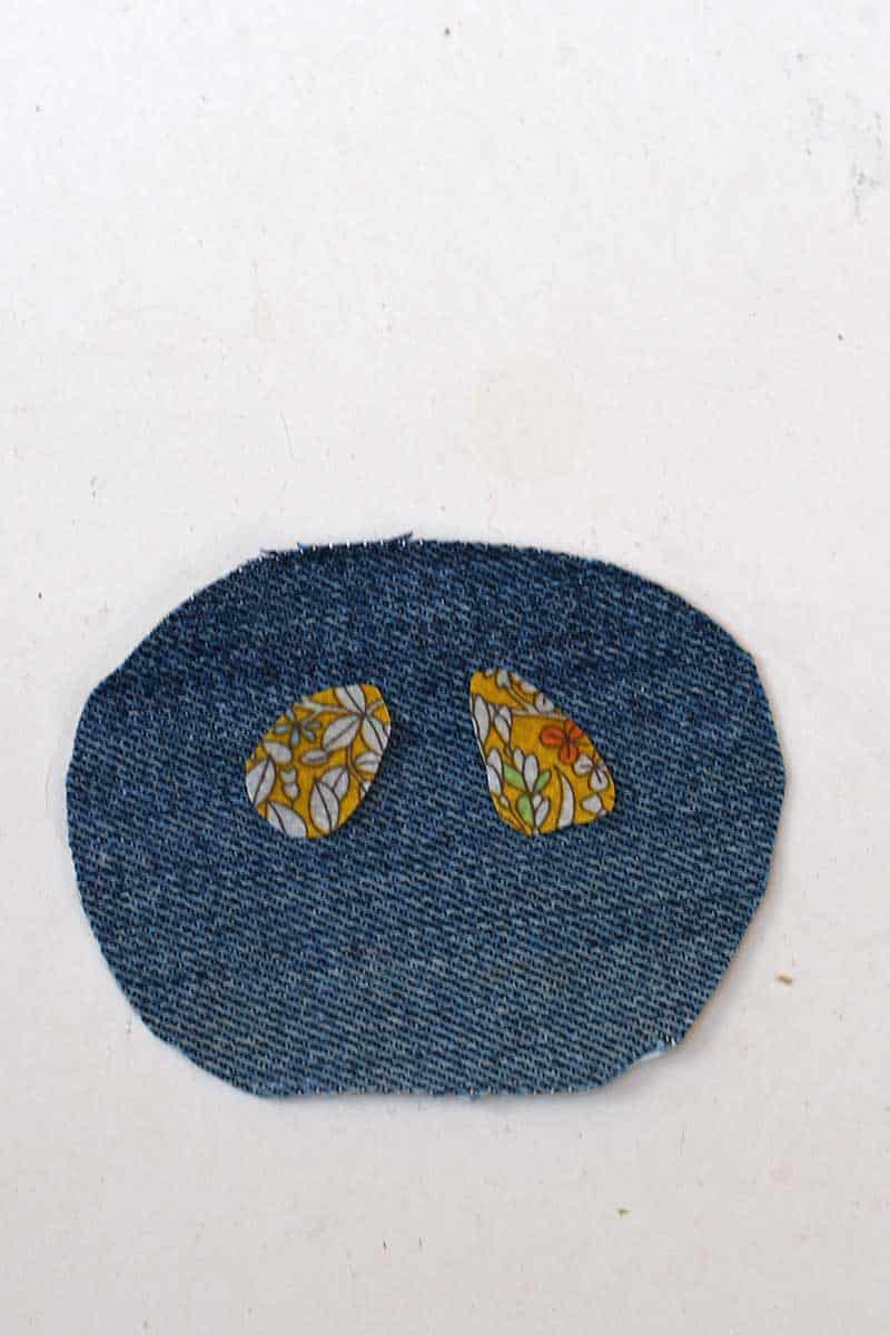 stitching on the patchwork eyes