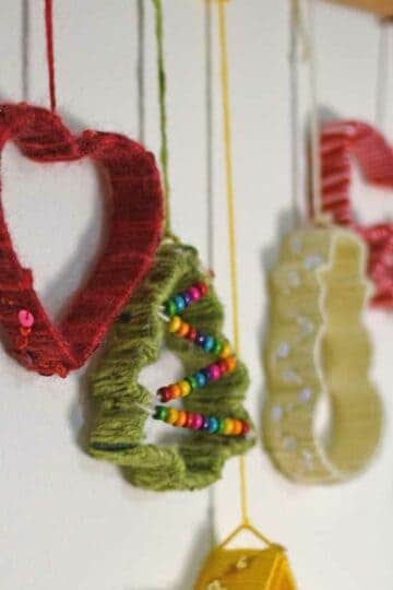 Yarn wrapped Christmas cookie cutters hanging decoration
